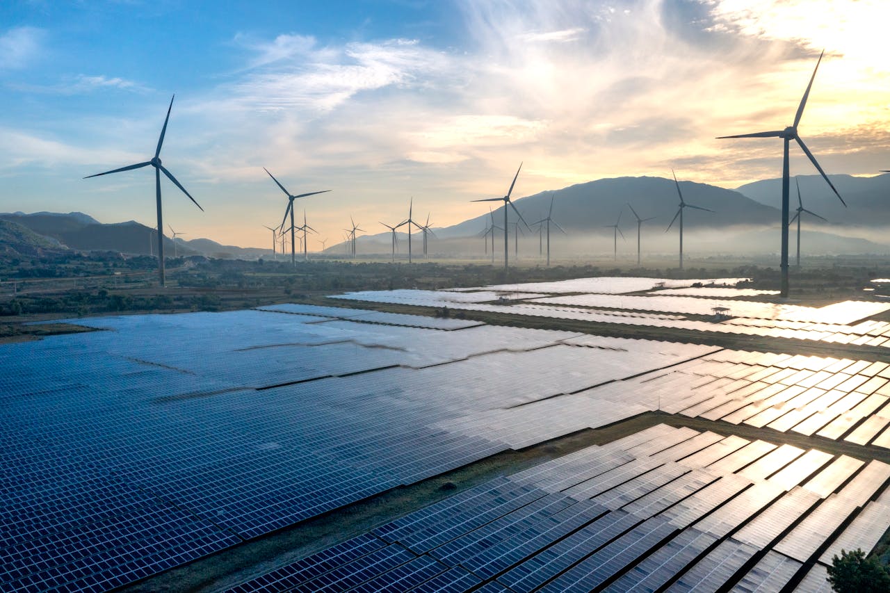 services-01 Scenic view of wind turbines and solar panels in Ninh Thuan, Vietnam, capturing sustainable energy efforts.